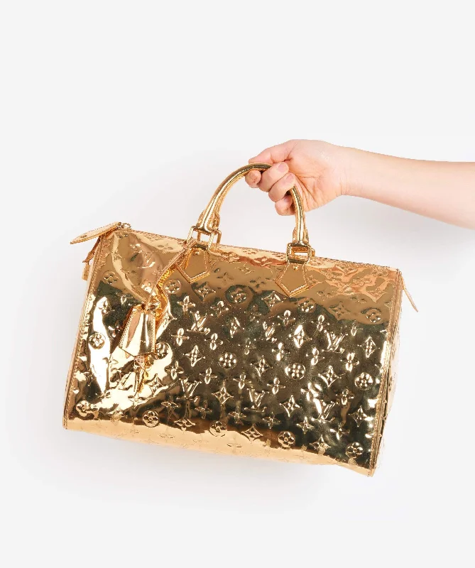 Louis Vuitton tote bags with a water - resistant coating for outdoor useLOUIS VUITTON Monogram Gold Mirror Speedy 35