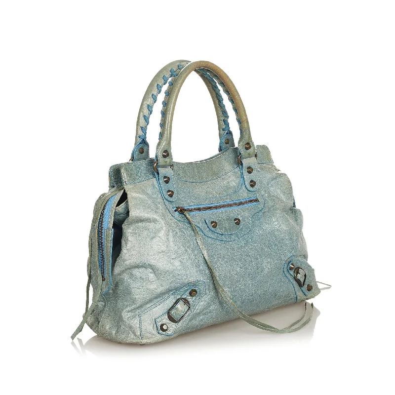 Water-resistant travel backpacksBalenciaga Motocross Classic Step Leather Handbag (SHG-25897)