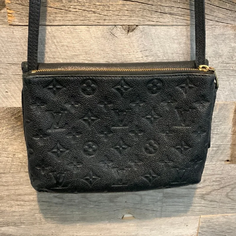 Louis Vuitton Twist bags with a snakeskin - effect panel for a bold lookLouis Vuitton Monogram Empreinte Twice Crossbody Bag