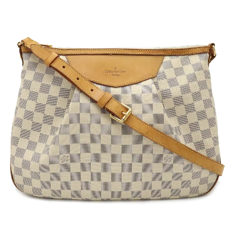 Louis Vuitton crossbody bags with a woven leather strap for textureLouis Vuitton Damier Azur Syracuse MM N41112