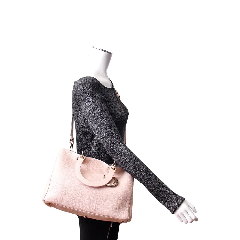 Christian Dior Saddle bags with a distressed leather finishCHRISTIAN DIOR Leather Medium Diorissimo Tote Pink